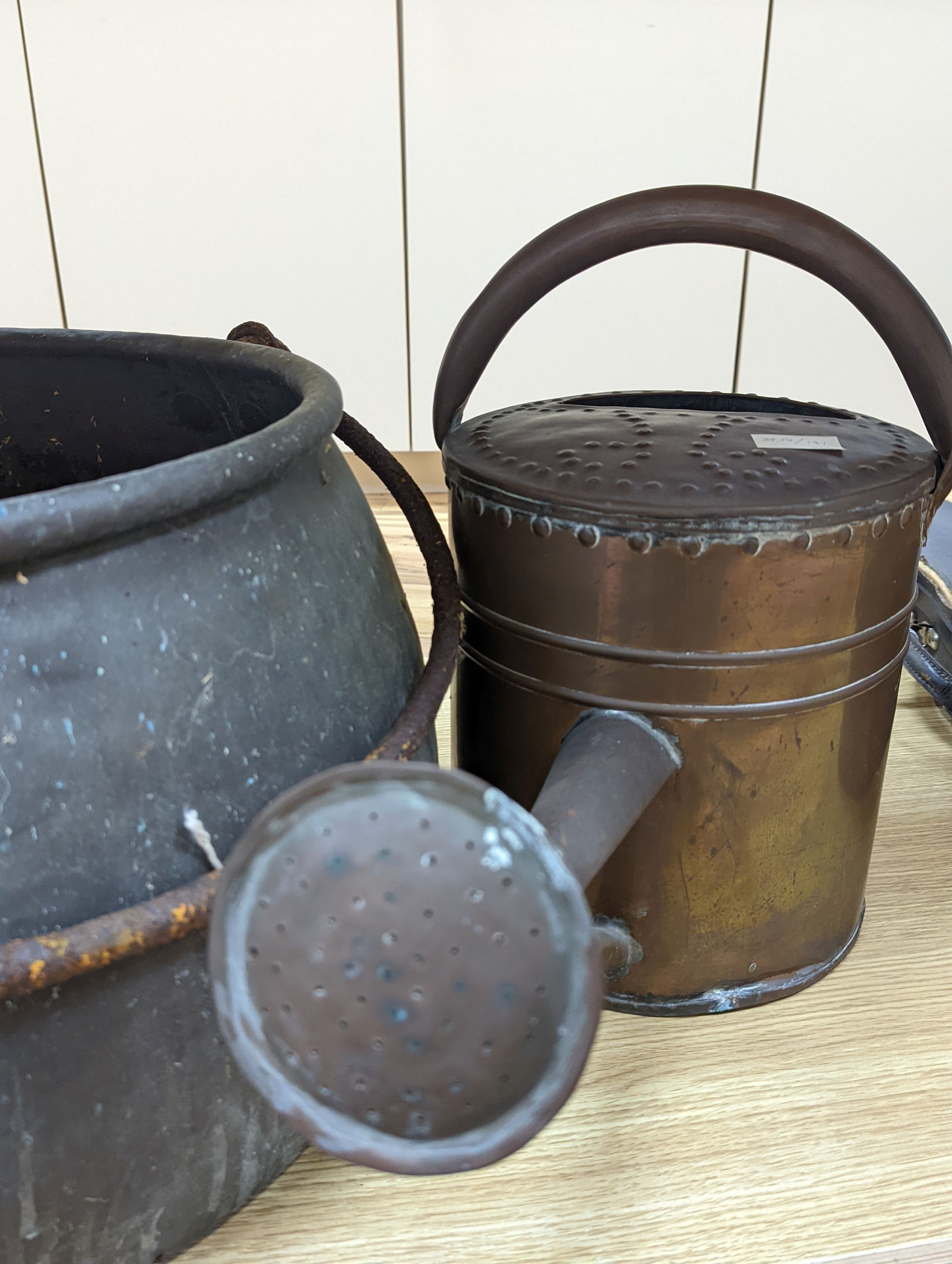 A large copper cauldron, 54cm wide and watering can